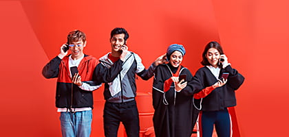 A hand holding the Red App with a network of friends surrounding it