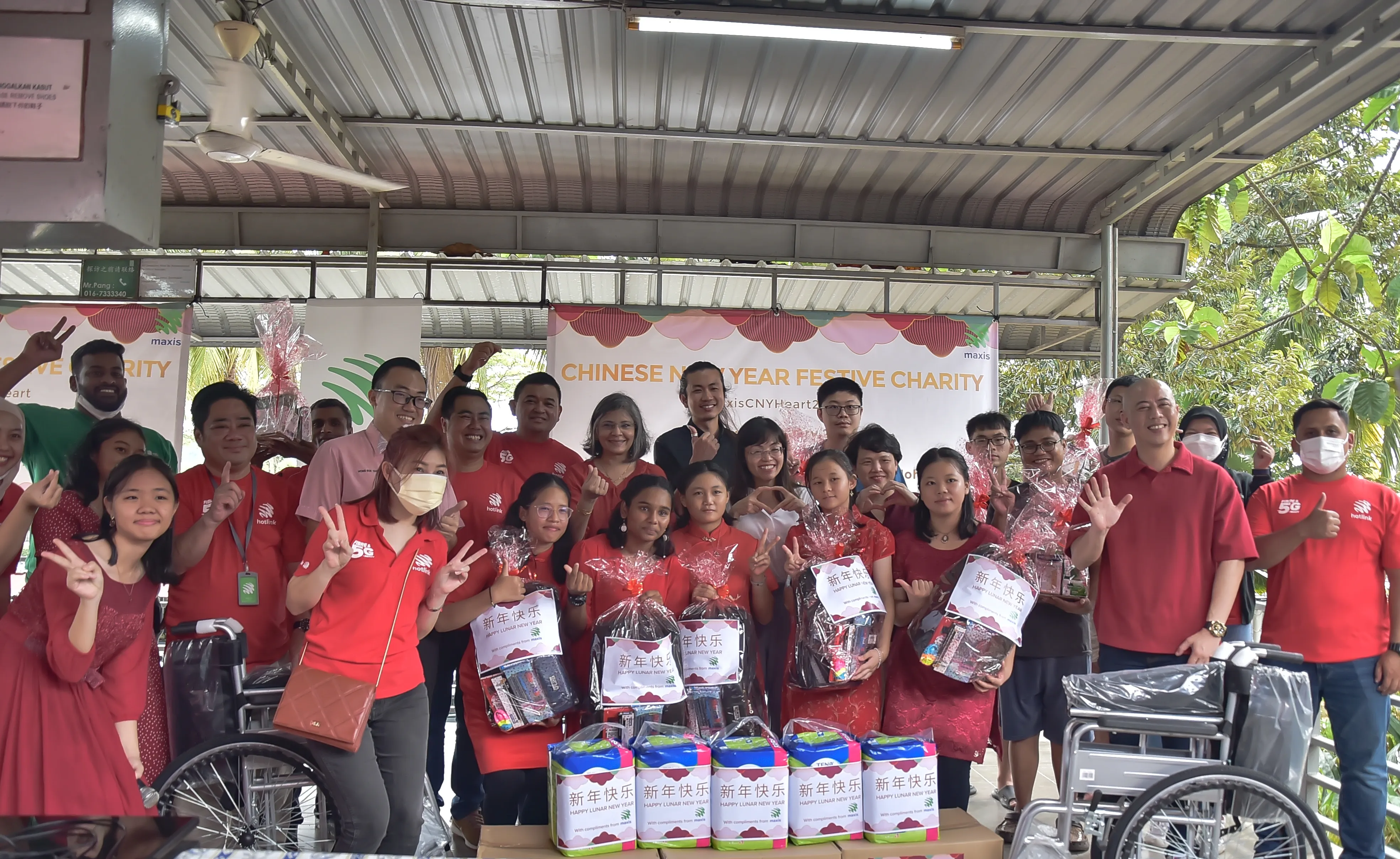 Photo 1 -Maxis distributes essential supplies and connects with communities this Chinese New Year